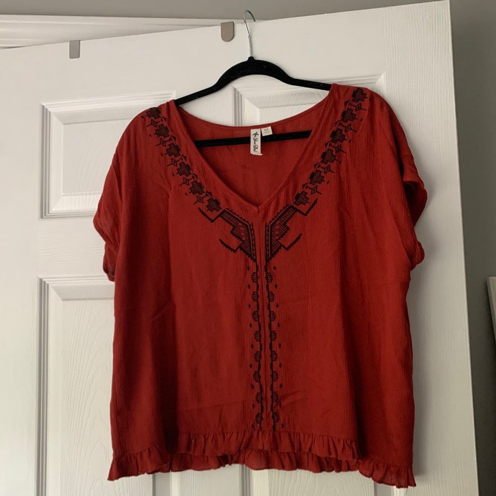 red-orange blouse
